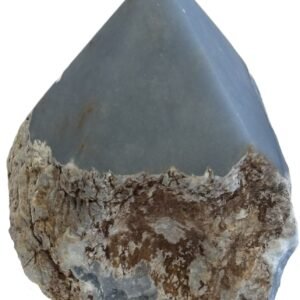 Natural rough angelite freeform with polished point 4 sians emporium Natural rough angelite freeform crystal with unpolished sides and a smooth polished blue point standing on a white background
